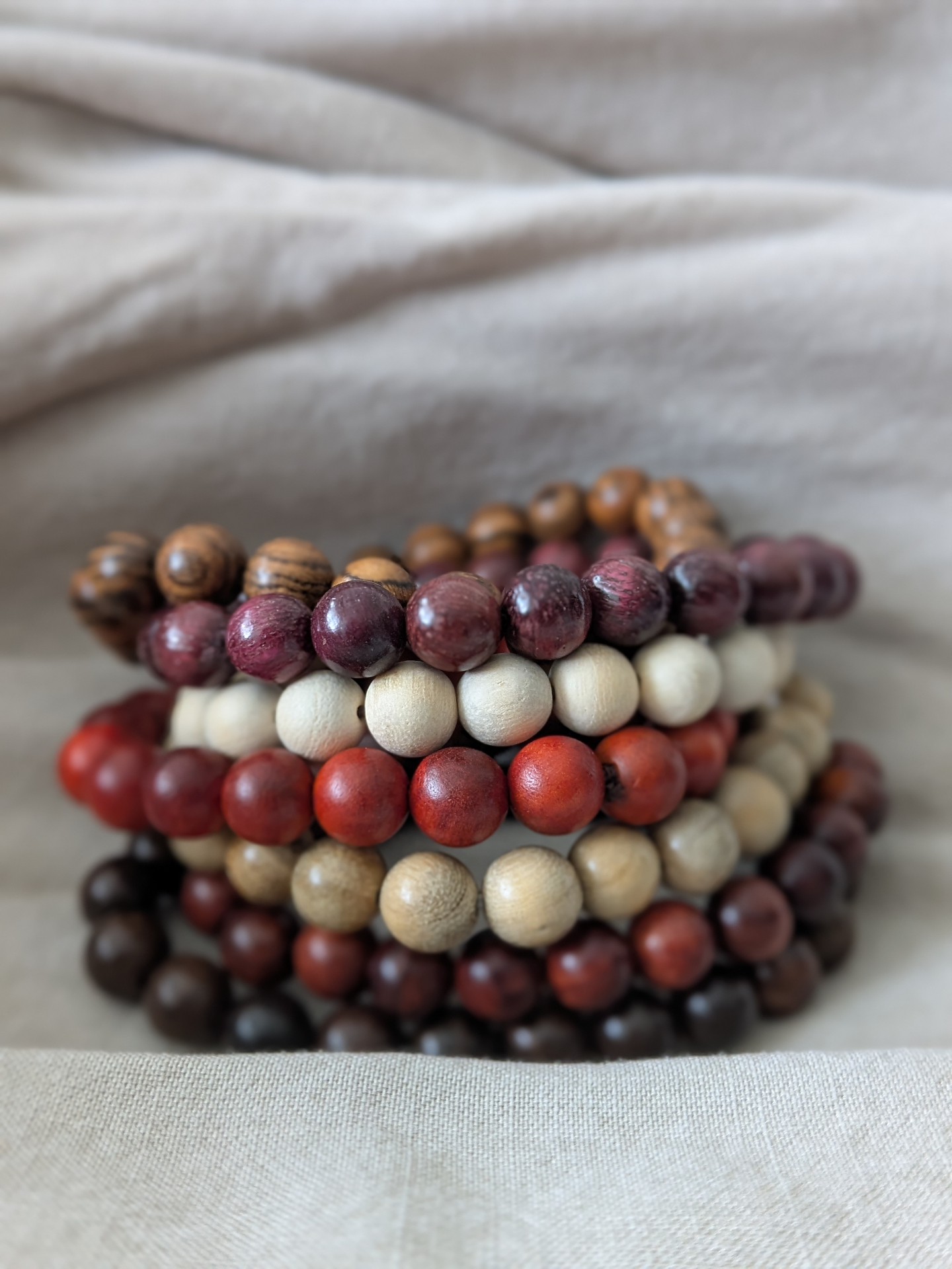 Beautiful collection of handcrafted malas in various wood types and colors